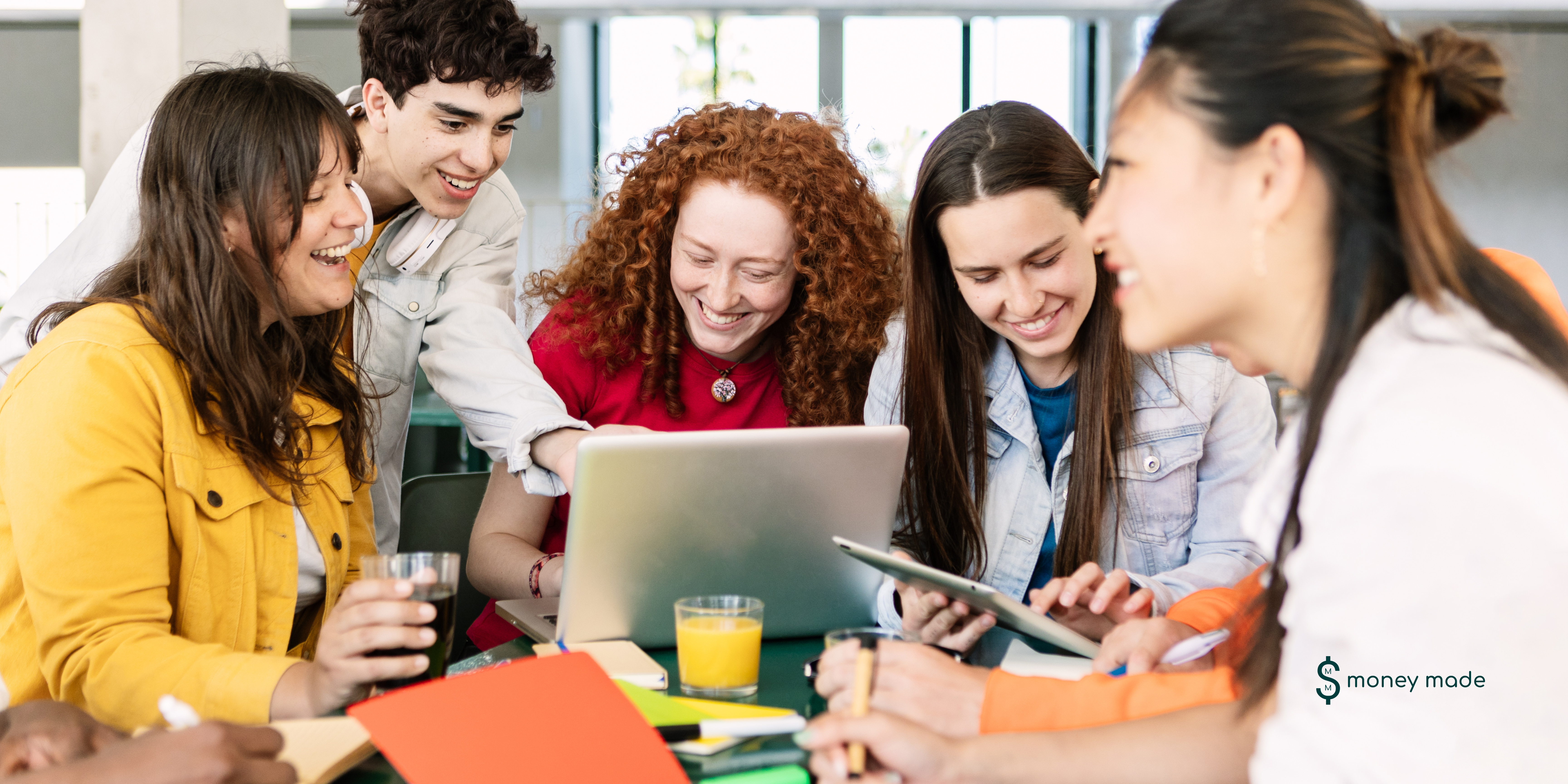 diverse teens smiling and learning together, perhaps with notebooks or laptops, alongside a parent helping out.